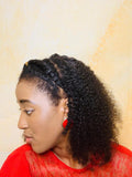 African american woman wearing kinky curly clip-in extensions from tamar beauty supply